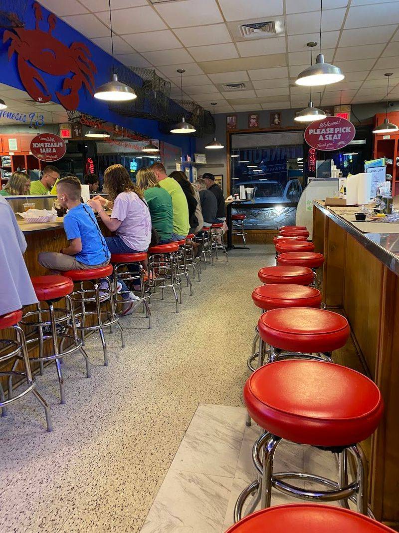 This North Carolina Seafood Spot Serves 2 Fried Shrimp Tacos For $18 - Decor Hint Spicy Drizzle Sauce That Brings The Heat