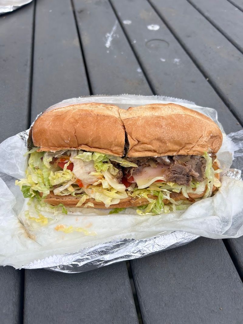 15 Oversized And Delicious Washington DC's Best Pork Sandwich Spots Loved By Locals - Decor Hint GW Delicatessen