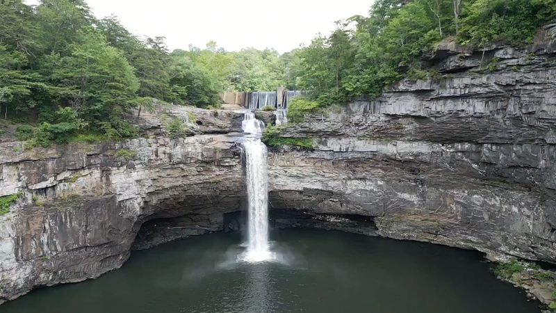 A 104-Foot Waterfall Surrounded By Forest