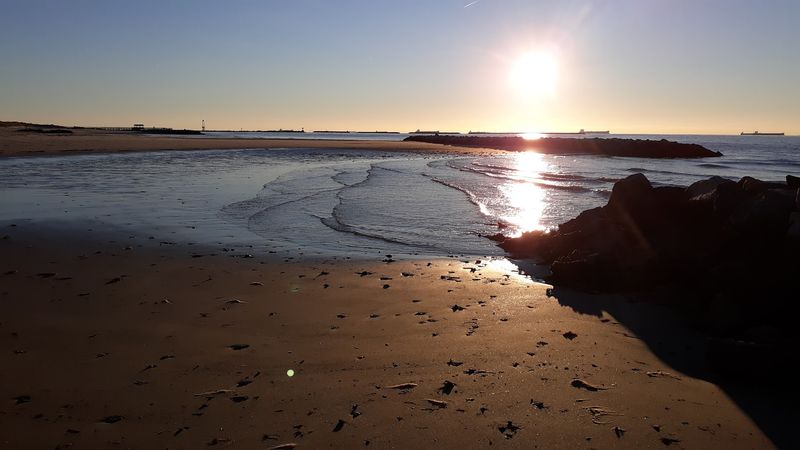 Kayaking And Paddleboarding On Calm Bay Waters