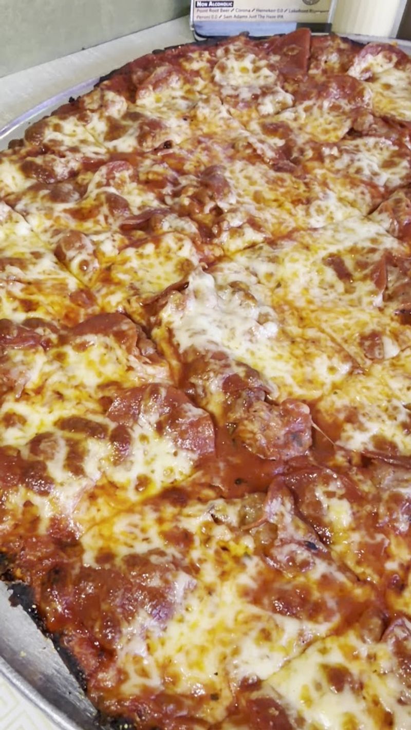 The Wisconsin Restaurant Where Pizza Has Been Stealing The Spotlight For Years - Decor Hint The Cracker-Thin Crust That Became A Legend