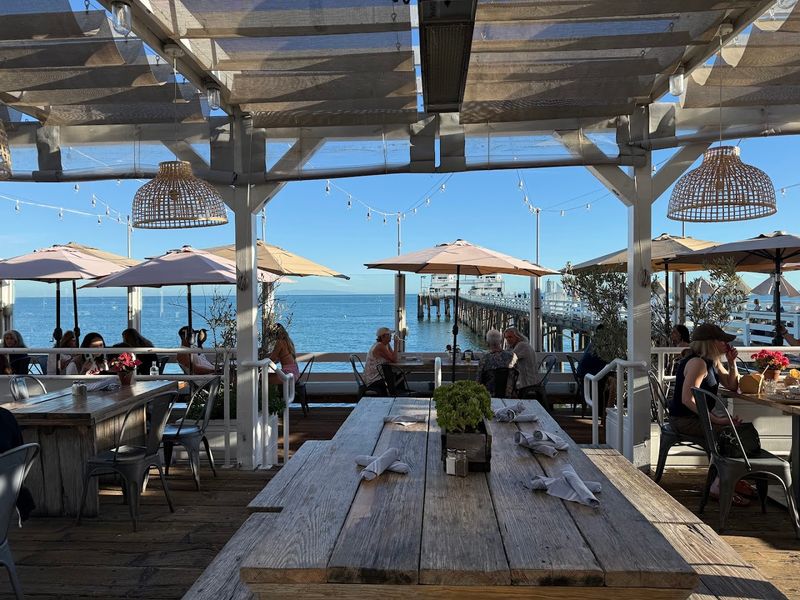 Sunlight, Salt Air, And Wooden Planks Shape The Experience