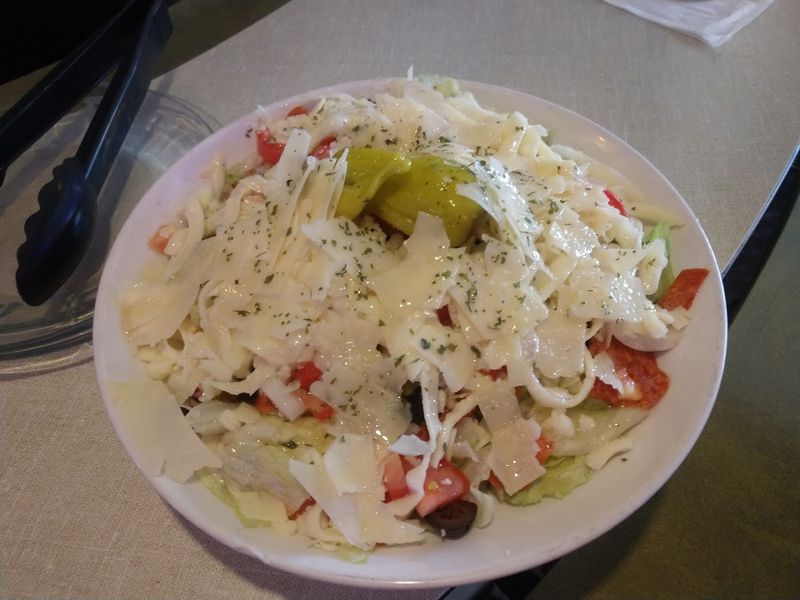 The Wisconsin Restaurant Where Pizza Has Been Stealing The Spotlight For Years - Decor Hint The Antipasto Salad And Starters Worth Ordering