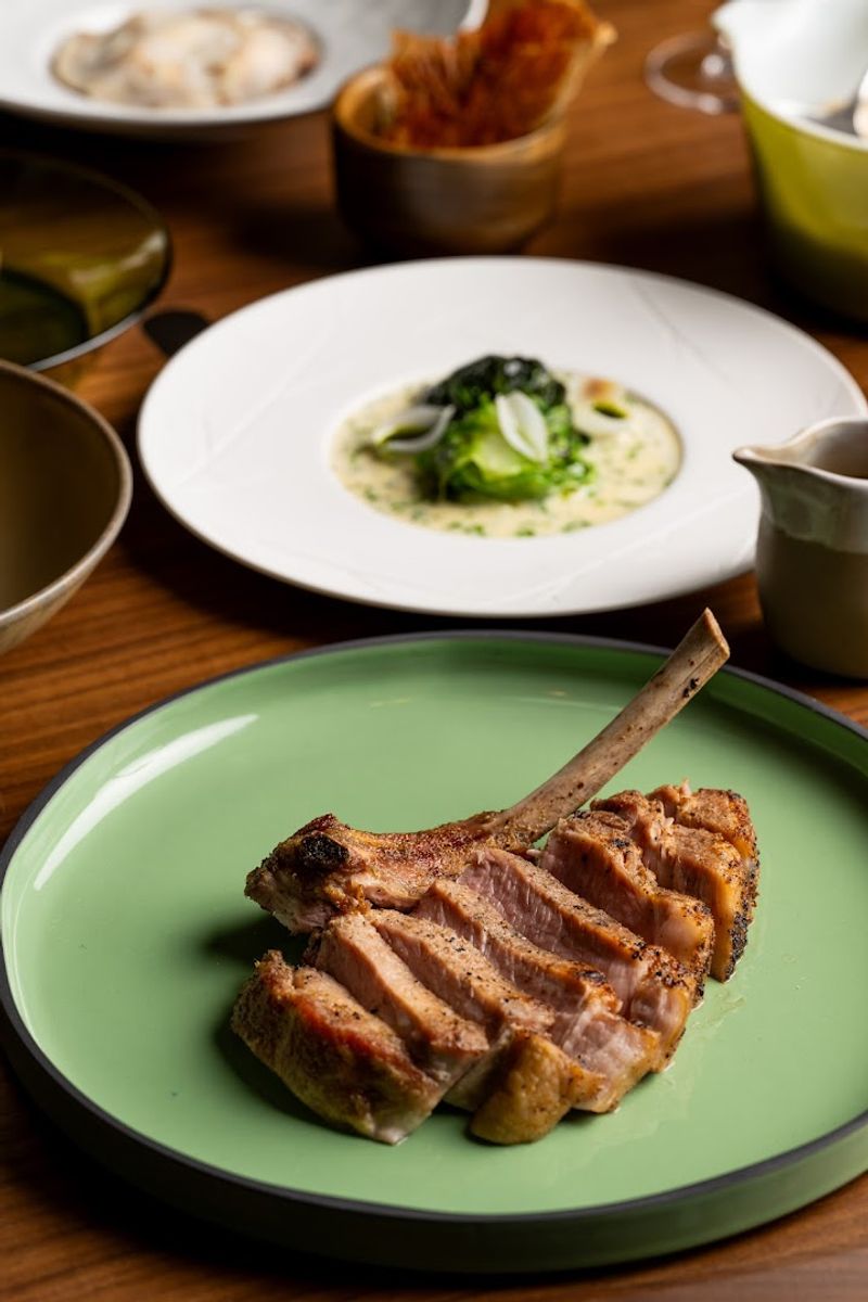 Heritage Duroc Pork Chop And Tierra Vegetables Hominy Grits As The Heart Of The Menu