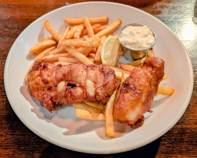 This Nebraska Fish And Chips Spot Is Turning A Simple Meal Into A Destination - Decor Hint Battered, Golden, And Completely Serious Fish