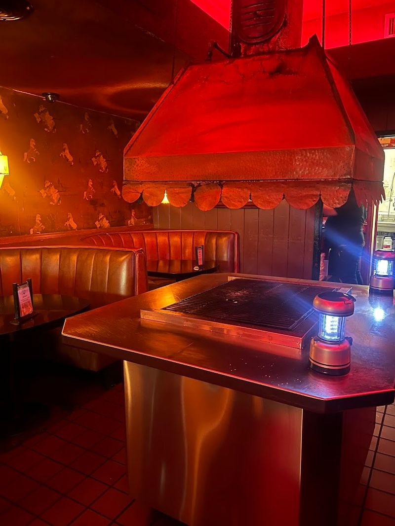 The Atmosphere Inside Wows With Red Lights And Retro Decor