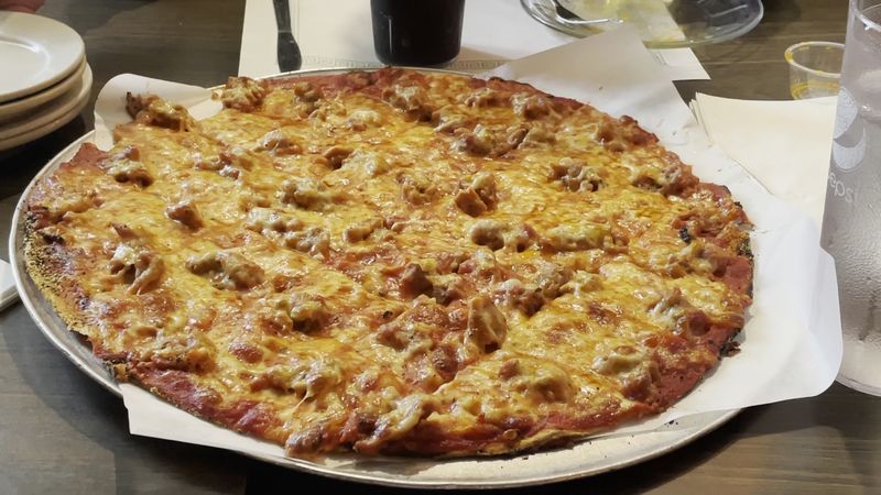 The Wisconsin Restaurant Where Pizza Has Been Stealing The Spotlight For Years - Decor Hint A Century of Thin-Crust Tradition That Never Got Old