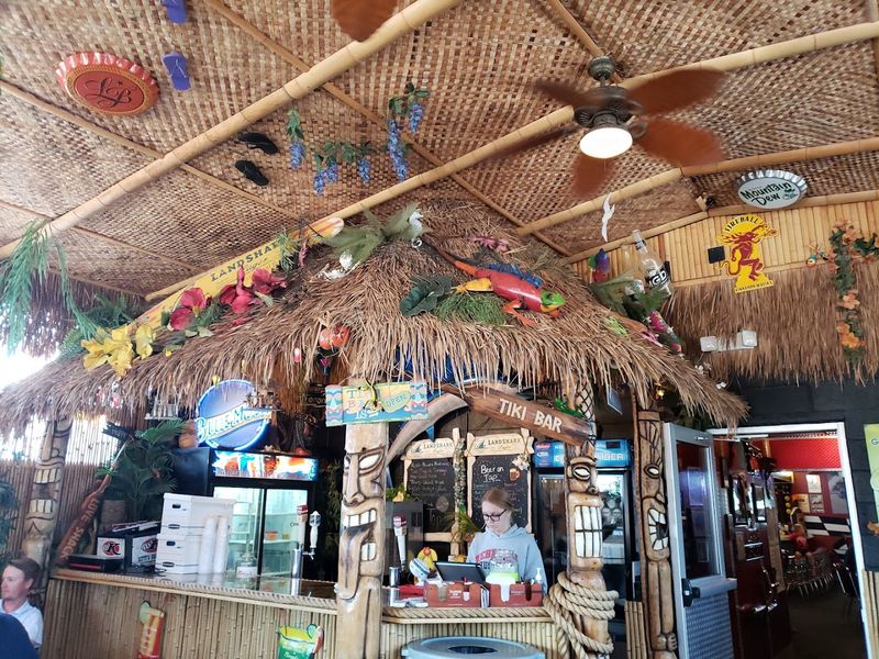 The Wonderfully Quirky Restaurant In Nebraska You'll Want To Visit Over And Over Again - Decor Hint The Tiki-Inspired Back Patio That Adds An Unexpected Outdoor Twist