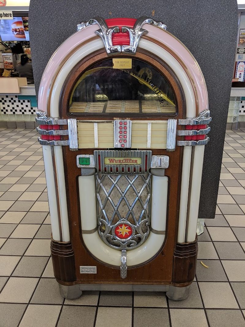 A Jukebox And Old-Fashioned Telephone Booth