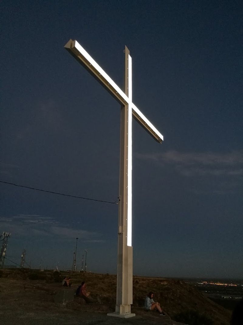 The Illuminated Cross Stands Out After Sunset From Below