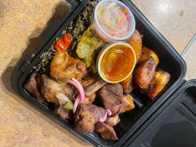 This North Carolina Haitian Spot Serves Griot And Island Comfort Food Worth The Drive - Decor Hint Griot Gives This East Charlotte Kitchen Its Crispy, Comfort-Food Hook