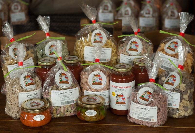 A Small Grocery Section Stocked With Italian Goodies To Take Home