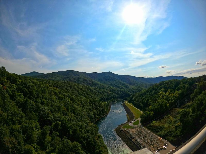 Walk Across A Dam That Feels Almost Too Big For The Mountains