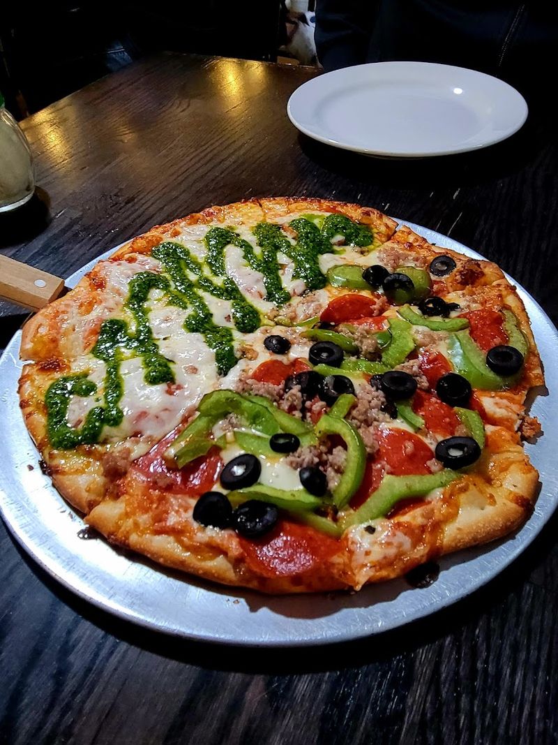 This Southeastern North Carolina Pizza Spot Serves Brick-Oven Pizzas Under The Southport Water Tower - Decor Hint This Brown Street Spot Turns Pizza Into A Southport Detour