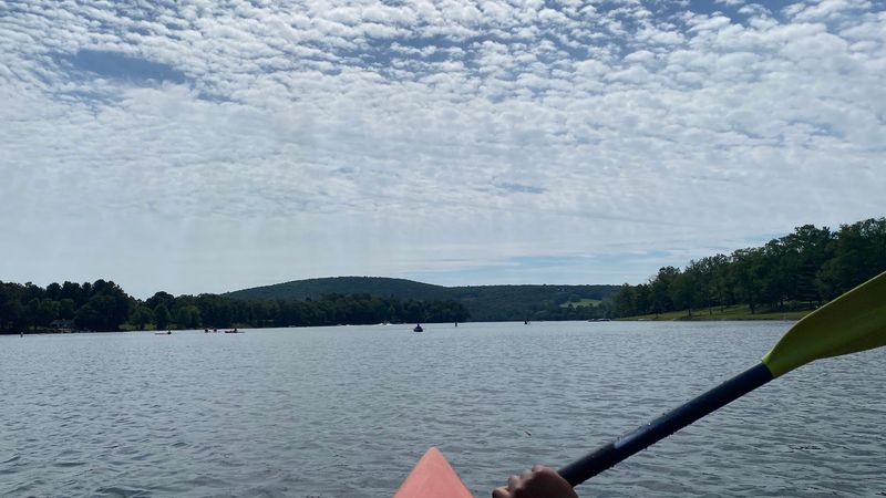 Paddleboarding On Calm Lake Waters