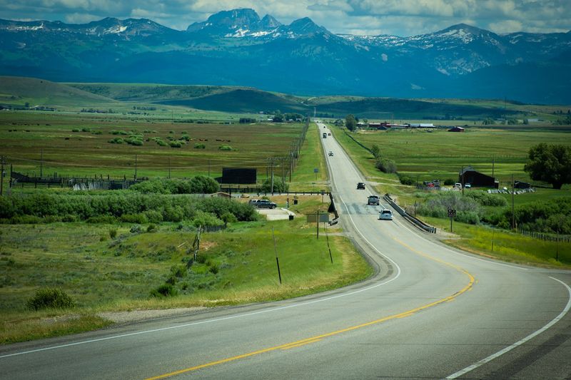 Farm Fields And Mountain Peaks Share The Same Windshield