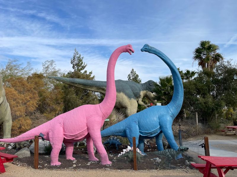 More Than 50 Dinosaur Figures Fill The Park Beyond The Famous Pair