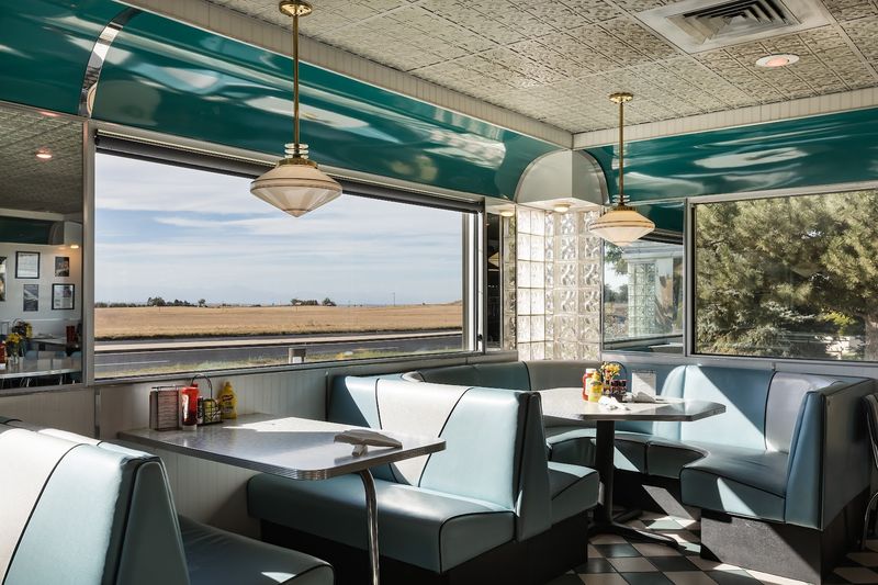 Checkered Floors And Turquoise Booths That Set The Mood