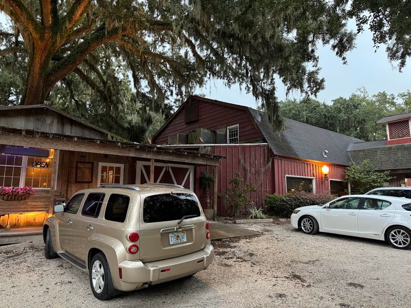 A Patio And Dance Floor Wrapped Around A Live Oak Tree