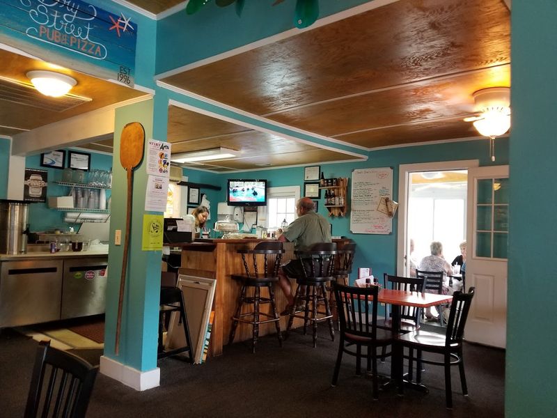 This Southeastern North Carolina Pizza Spot Serves Brick-Oven Pizzas Under The Southport Water Tower - Decor Hint House-Made Touches Make The Pub Feel Personal