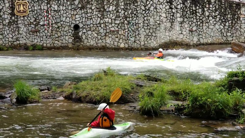 Kayakers Get A Classic Whitewater Run Through Mountain Scenery