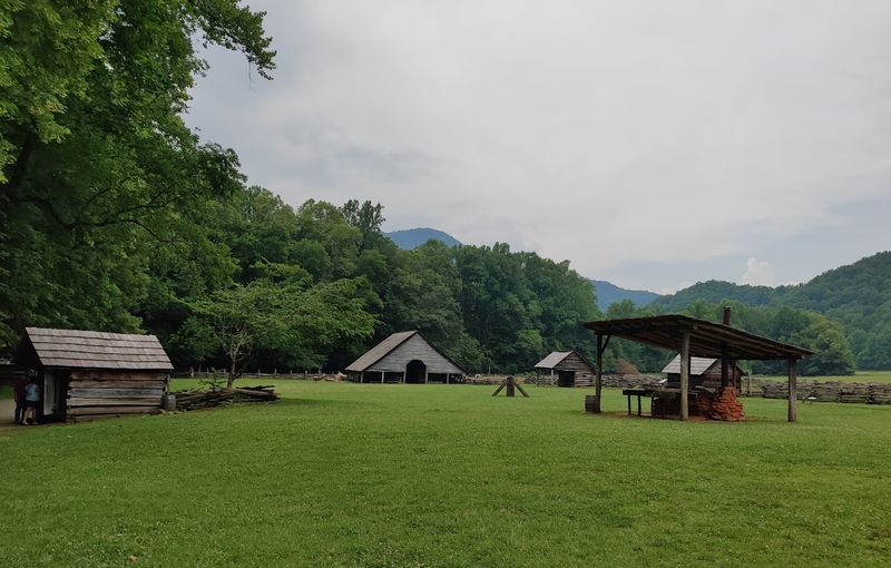 This North Carolina Mountain Farm Museum Feels Like Walking Into Appalachian History - Decor Hint Cherokee's Smokies Entrance Gives The Visit A Scenic Backdrop