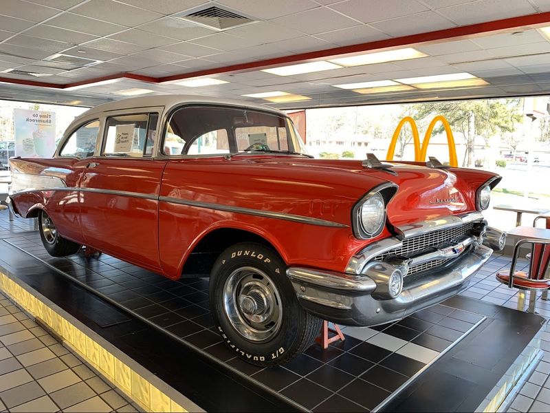 A 1957 Chevrolet Parked Right Inside The Dining Room