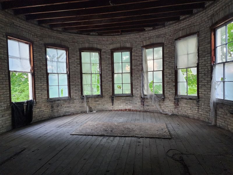 This Eerie Michigan Asylum Tour Hides A Whole World Beneath The Surface - Decor Hint Inside The Unrenovated Cottages