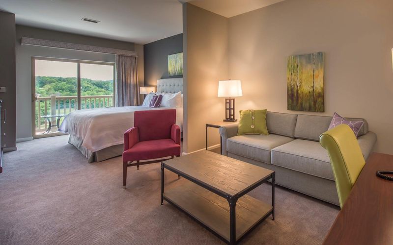 Refined Suites With Fireplaces And Balcony Views