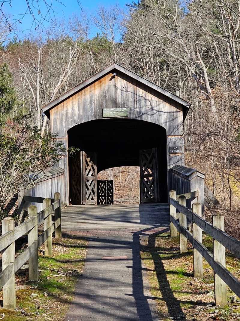 The Mysterious Connecticut Covered Bridge You Might Want To Avoid After Dark - Decor Hint Dark Timber Frames A Bright Opening Above The Water