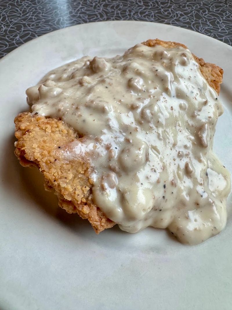 Country-Fried Steak Arrives Crisp, Hearty, And Covered In Gravy