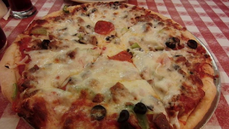 Order A Pizza Buried Beneath A Generous Layer Of Cheese
