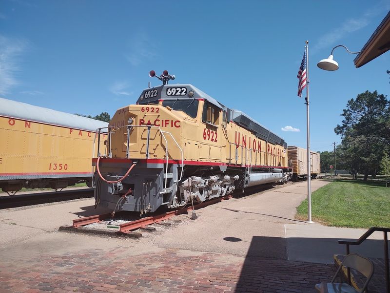 A Miniature Train Carries Families Around The Park