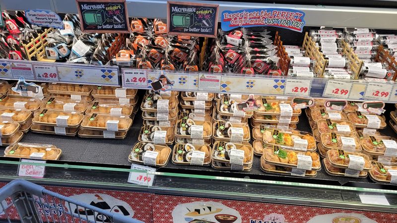 Fresh Sushi And Sashimi Fill The Refrigerated Cases
