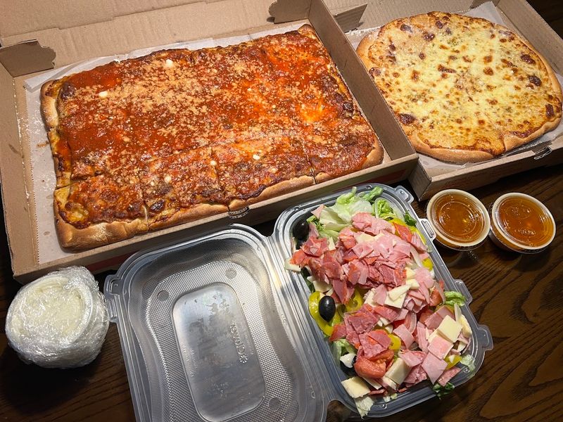 Everyone In New York Needs To Taste The Iconic Pizza At This Small-Town Restaurant - Decor Hint You Can Order Pizza Shipped Across The Country