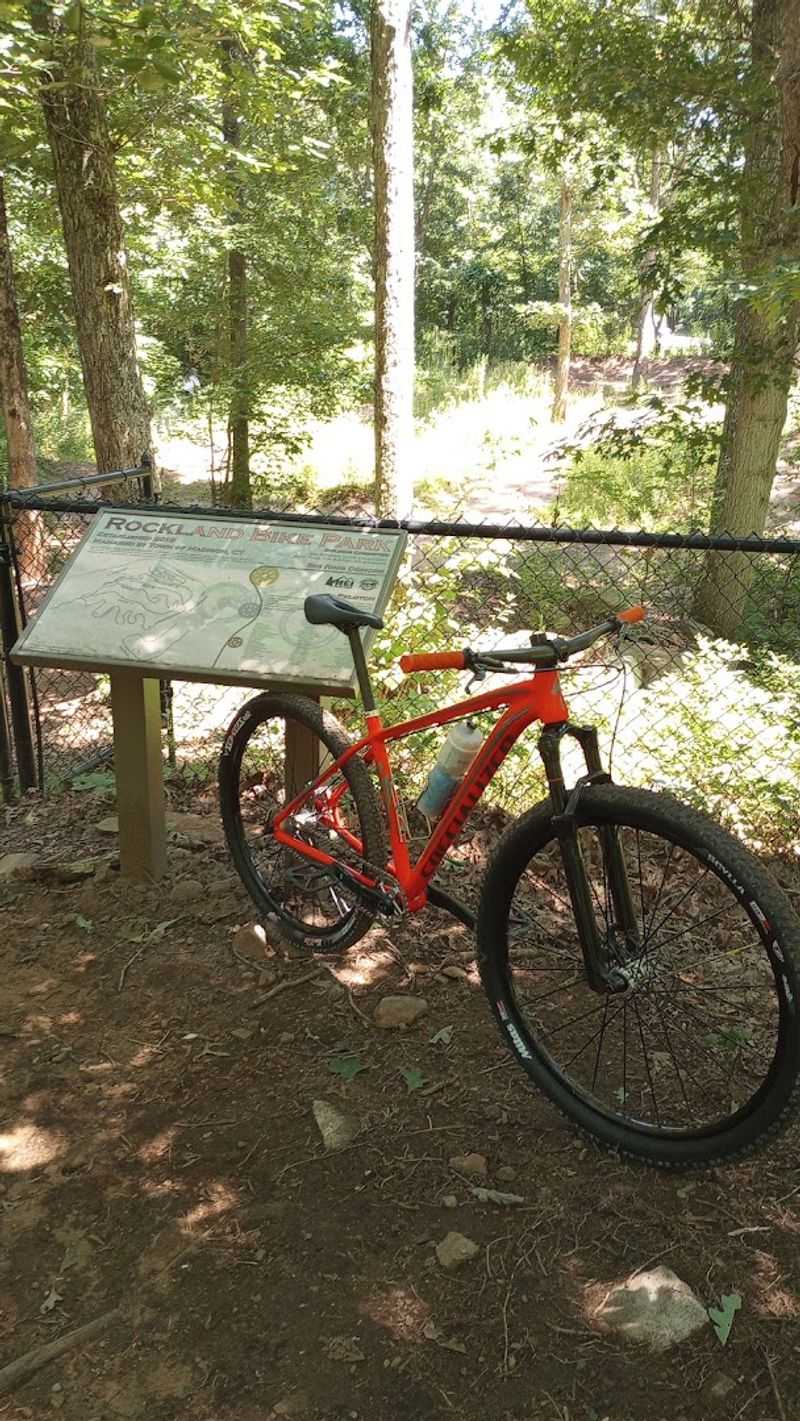 A Family Riding Area Wrapped Around Rocks And Trees