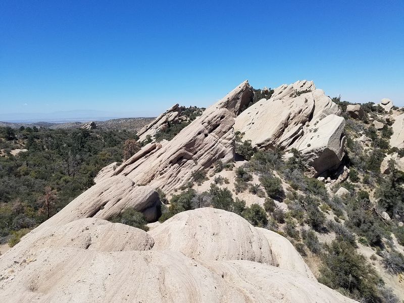 These 12 California Trails Lead To Giant Boulders, Slot Canyons, And Surreal Rock Formations - Decor Hint Devil's Punchbowl Loop or Devil's Chair Trail, Pearblossom