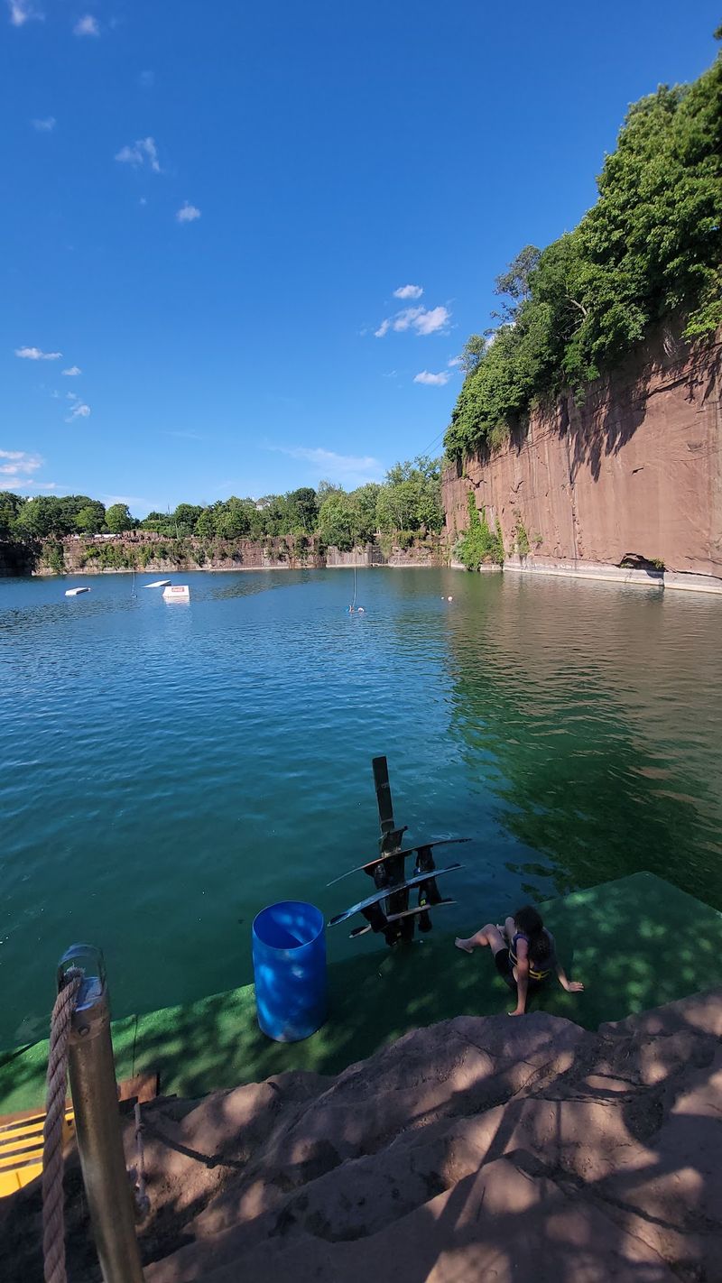 Massive Brownstone Cliffs Above The Water