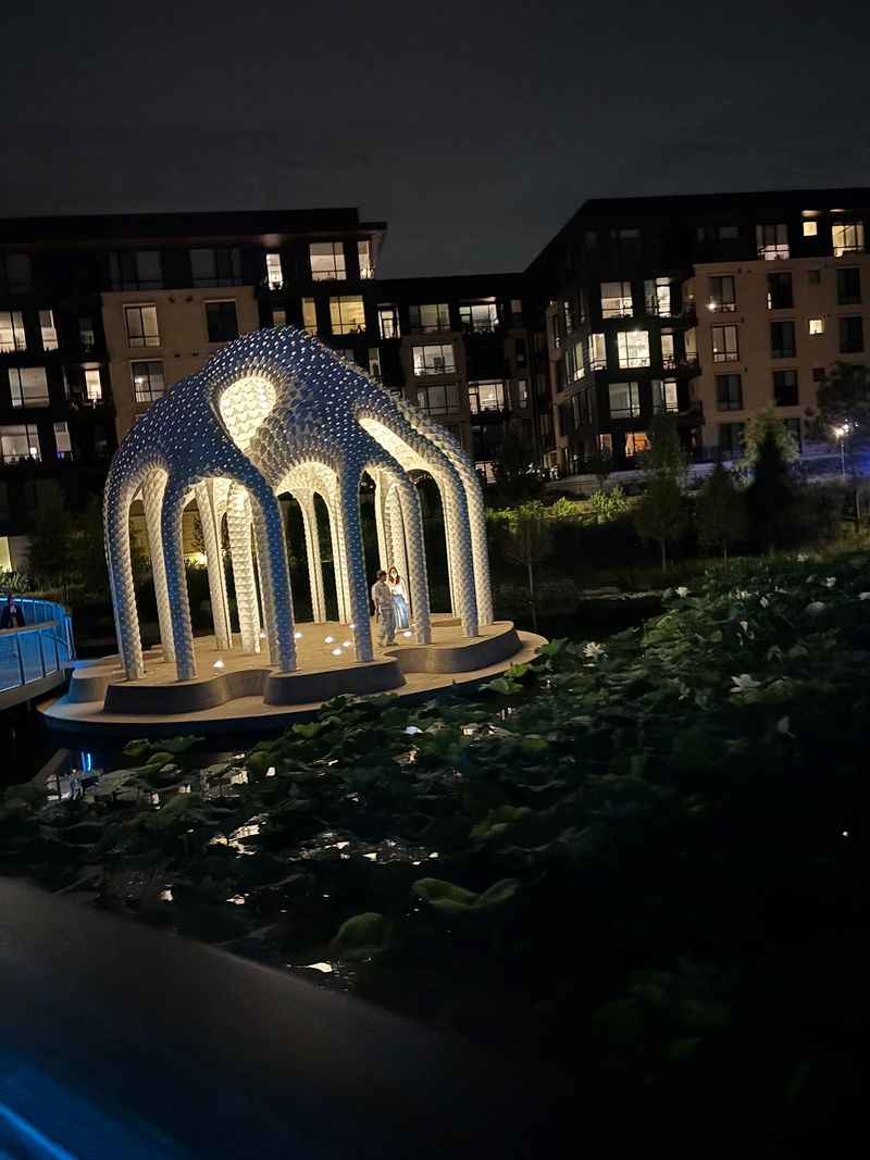 This 17-Foot-High North Carolina Skywalk Turns Into A Glowing Light Tunnel After Dark - Decor Hint Daylight Shows Off The Design, But Night Is When It Really Comes Alive