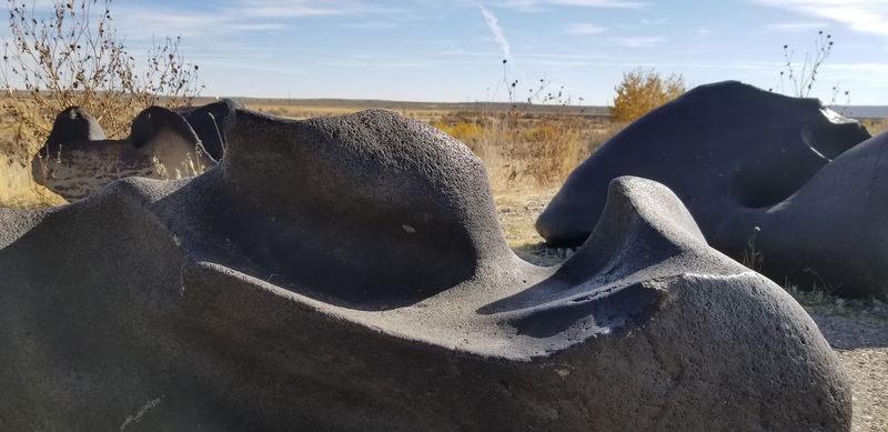 Rust-Colored Streaks Break Up The Dark Basalt In Surprising Patterns