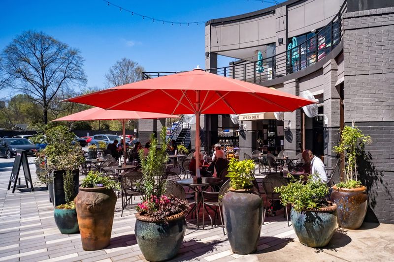 The Heated Patio With Red Umbrellas