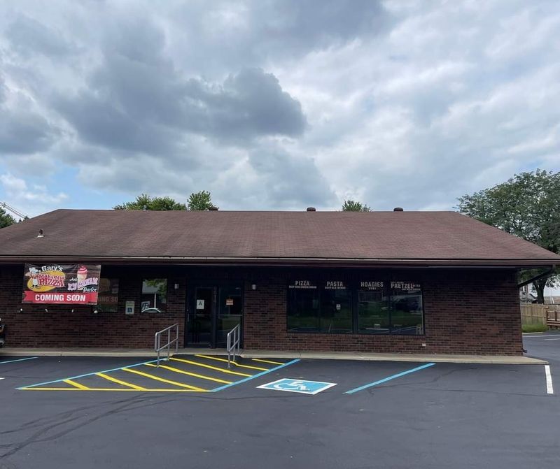A Neighborhood Corner With Pizza And Ice Cream Under One Roof