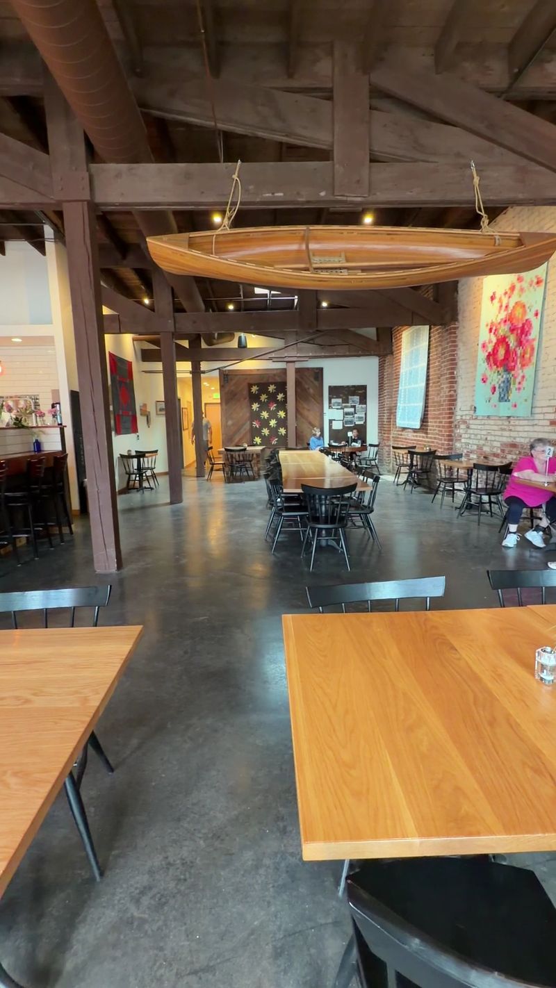 This Idaho Bakery Hides Inside A 1920s Service Station With An Old Safe Turned Into An Oven - Decor Hint Old Beams And Restored Details Keep The Building's Service-Station Past Visible