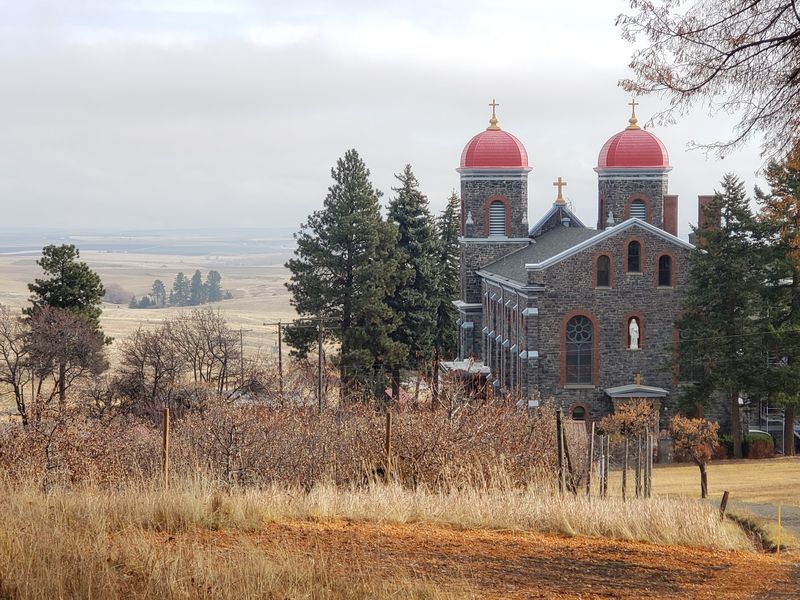 The Contrast Between Open Prairie And Monumental Stone Architecture Makes The Arrival Unforgettable