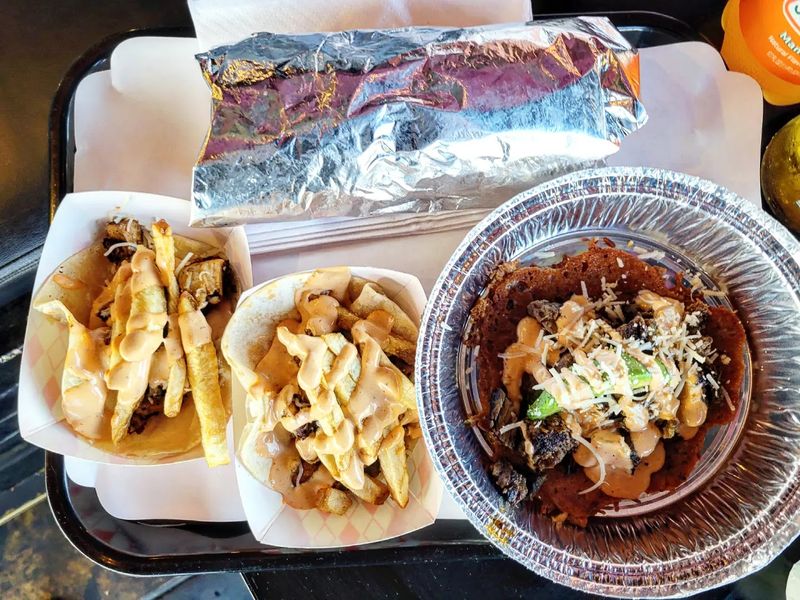 Dig Into Champion Fries Loaded With Cheese, Beans, Guacamole, And More