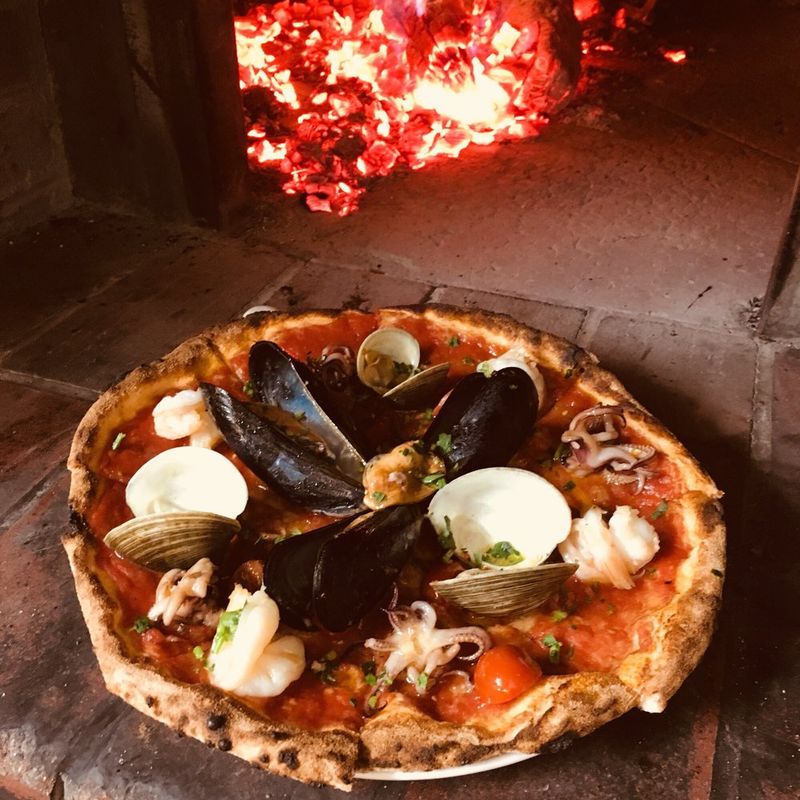 Wood-Fired Pizza Straight From The Oven