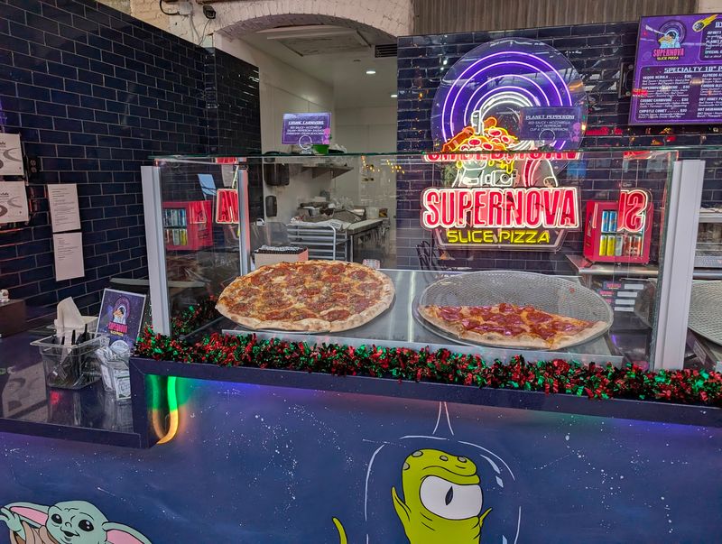 Supernova Slice Pizza With An Arcade Right Next Door