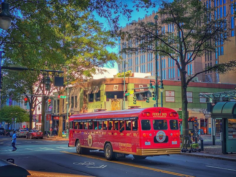 This Wild 90-Minute North Carolina Bus Tour Turns Sightseeing Into A Rolling Comedy Show - Decor Hint Uptown Landmarks Become Backdrops For Jokes Instead Of Dry Commentary