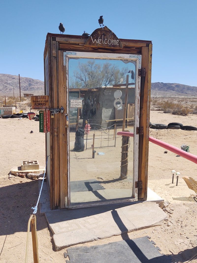 Glass Outhouse Art Gallery Means Exactly What It Says