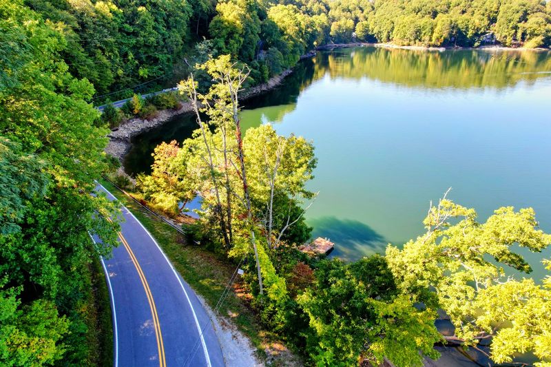 Watch The Mountains Close In Around You From The Middle Of The Lake